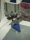 Photo of toolhead for dispensing robot, used to select one of 6 biomaterials for construction of multicomponent scaffolds.