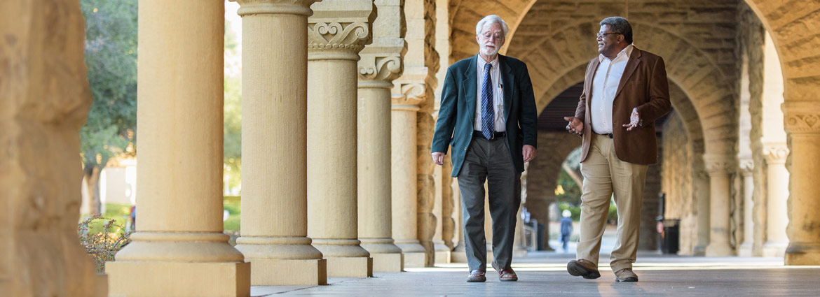 Two philosophy professors walking through the cloisters 