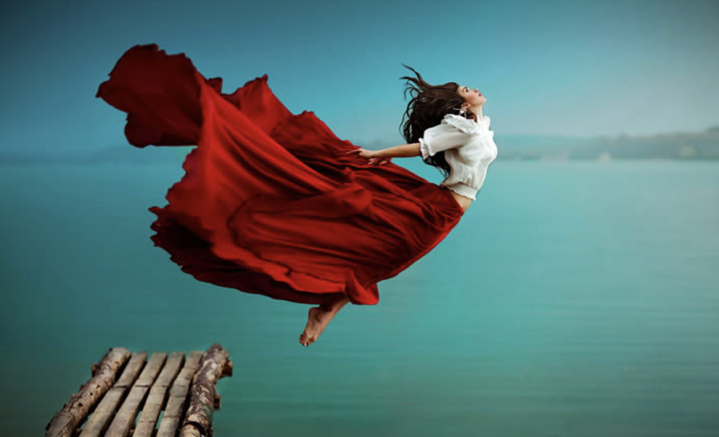 A picture of a woman leaping into the water in a 'leap of faith'