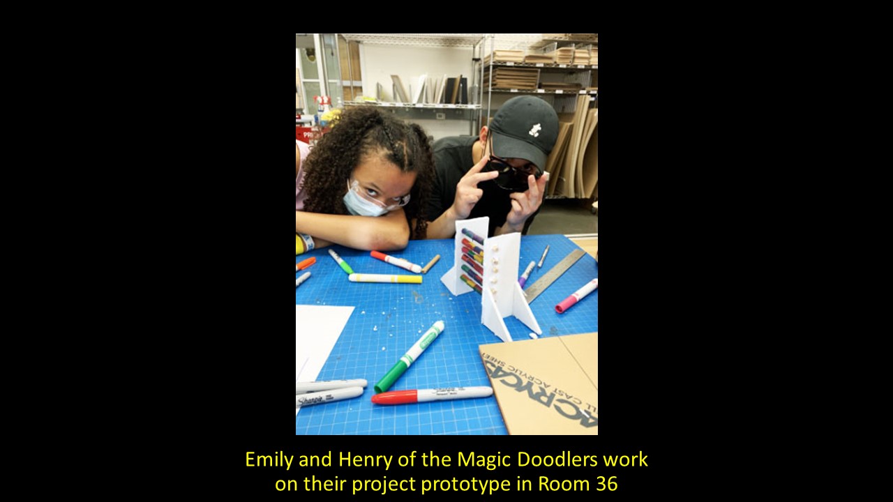 Emily and Henry of the Magic Doodlers work on their project in Room 36