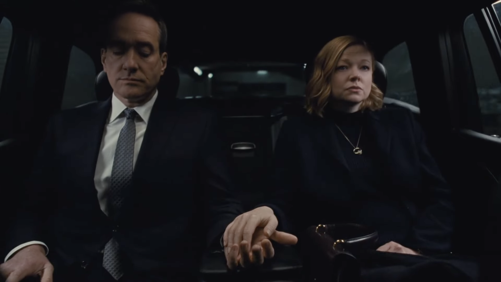 Shiv uneasily placing her hand in Tom’s as they ride in the back of a chauffeured car. Shiv looks ahead, reckoning with where she has ended up.